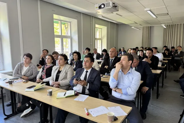audience sitting in the room and listening to the presentations